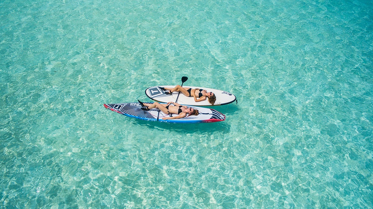 women on inflatable sup boards