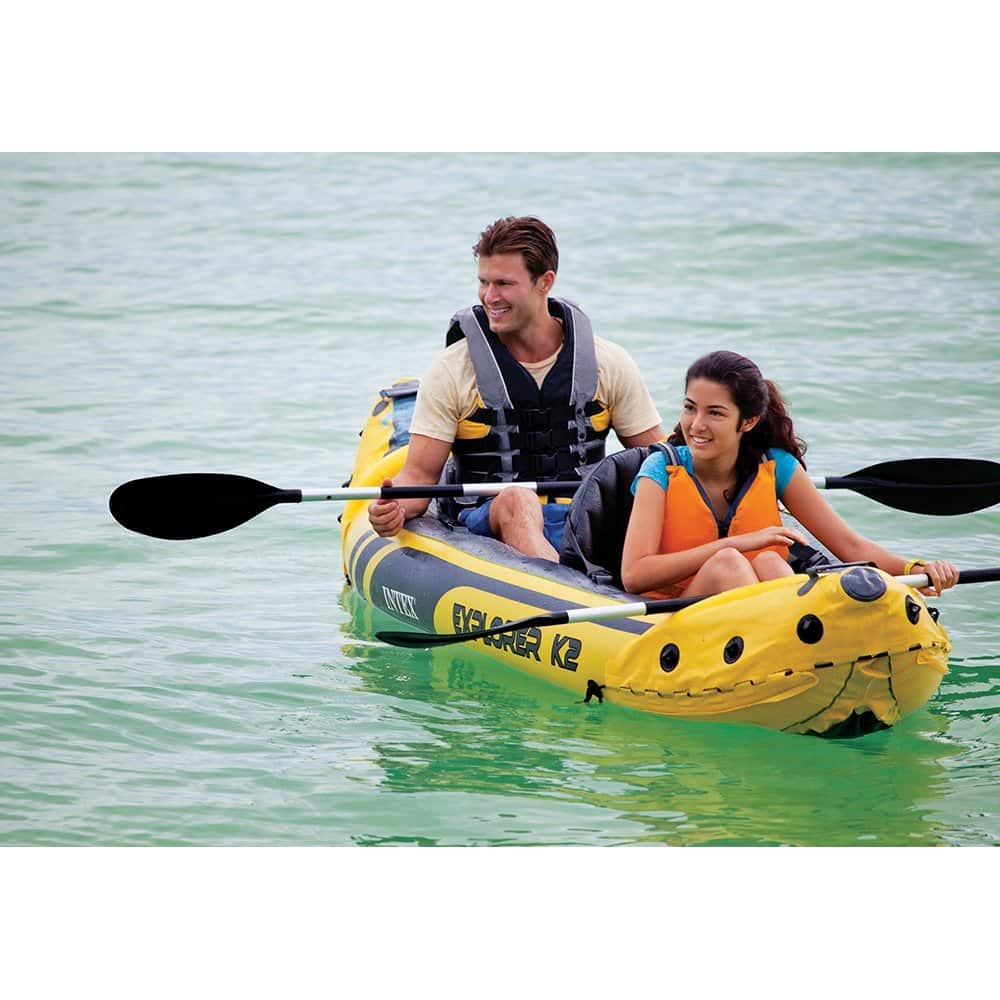 Father and daughter on inflatable kayak
